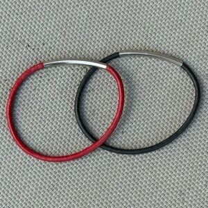 1/8” Wide Red and Black Leather Bracelets with Silver or Stainless Steel wrap.